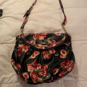 Juicy Couture crossbody purse.  Plenty of room and pockets. Used briefly.